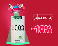An advertisement for Okamoto condoms featuring a box of "003 Platinum" condoms illuminated by a green beam from a cartoon UFO. The UFO is shaped like a condom with wings and hearts. To the right, the Okamoto logo is shown above a "-10%" discount offer on a red background.