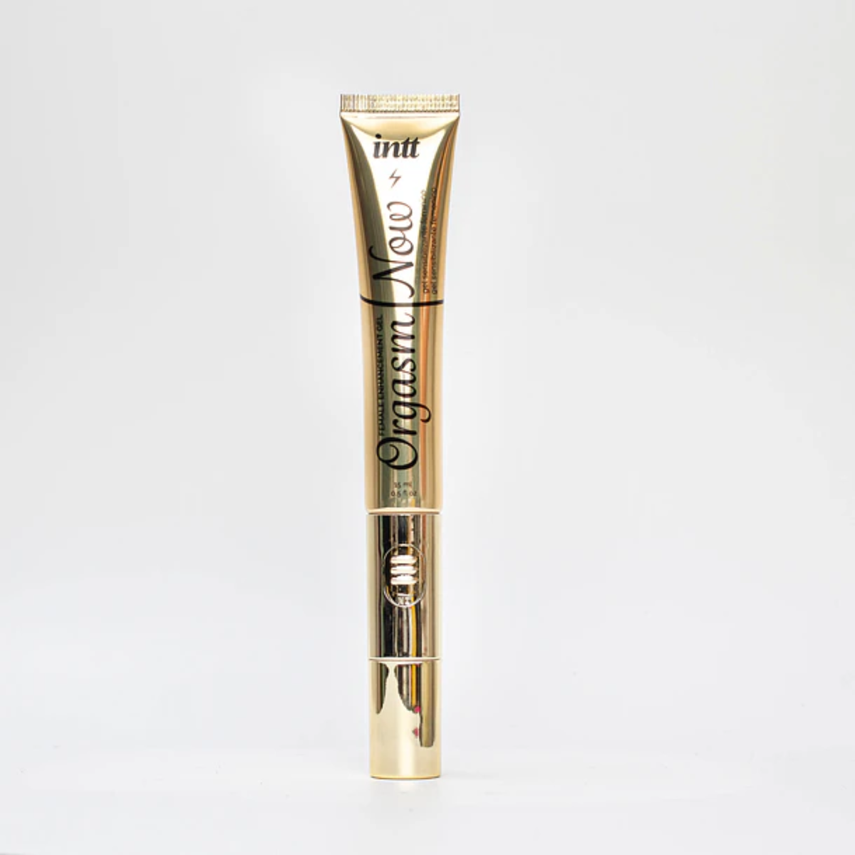 A sleek, vertical gold tube of Intt Orgasm Now Female Enhancement Gel (0.5 fl oz) featuring a metallic gold finish and a visible power switch for the vibrating tip applicator, centered on a solid white background.
