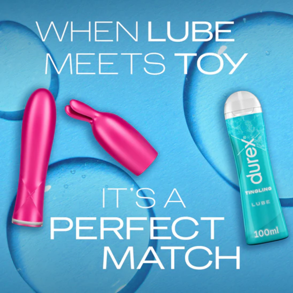 A product shot featuring a blue Durex Tingle Lube bottle and two bright pink vibrators against a light blue, water-textured background. The text reads: "WHEN LUBE MEETS TOY IT'S A PERFECT MATCH."