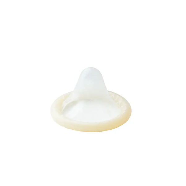 Studio shot of a single unrolled transparent latex condom standing upright on its base against a plain white background.