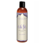 Front product view of the compact 60 ml (2 fl oz) amber bottle of Intimate Earth Ease relaxing anal silicone glide with purple petal design accents.