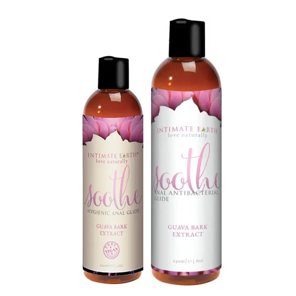 Size comparison view showing the 120 ml (4 fl oz) and 240 ml (8 fl oz) amber bottles of Intimate Earth Soothe antibacterial anal glide standing side by side.