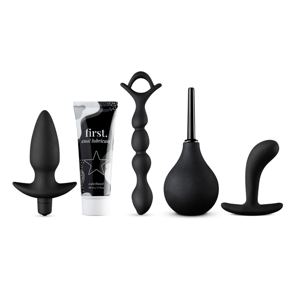 A complete set of five black products for anal play, including two different butt plugs, a beaded anal chain, a rubber douche, and a tube of water-based anal lubricant.