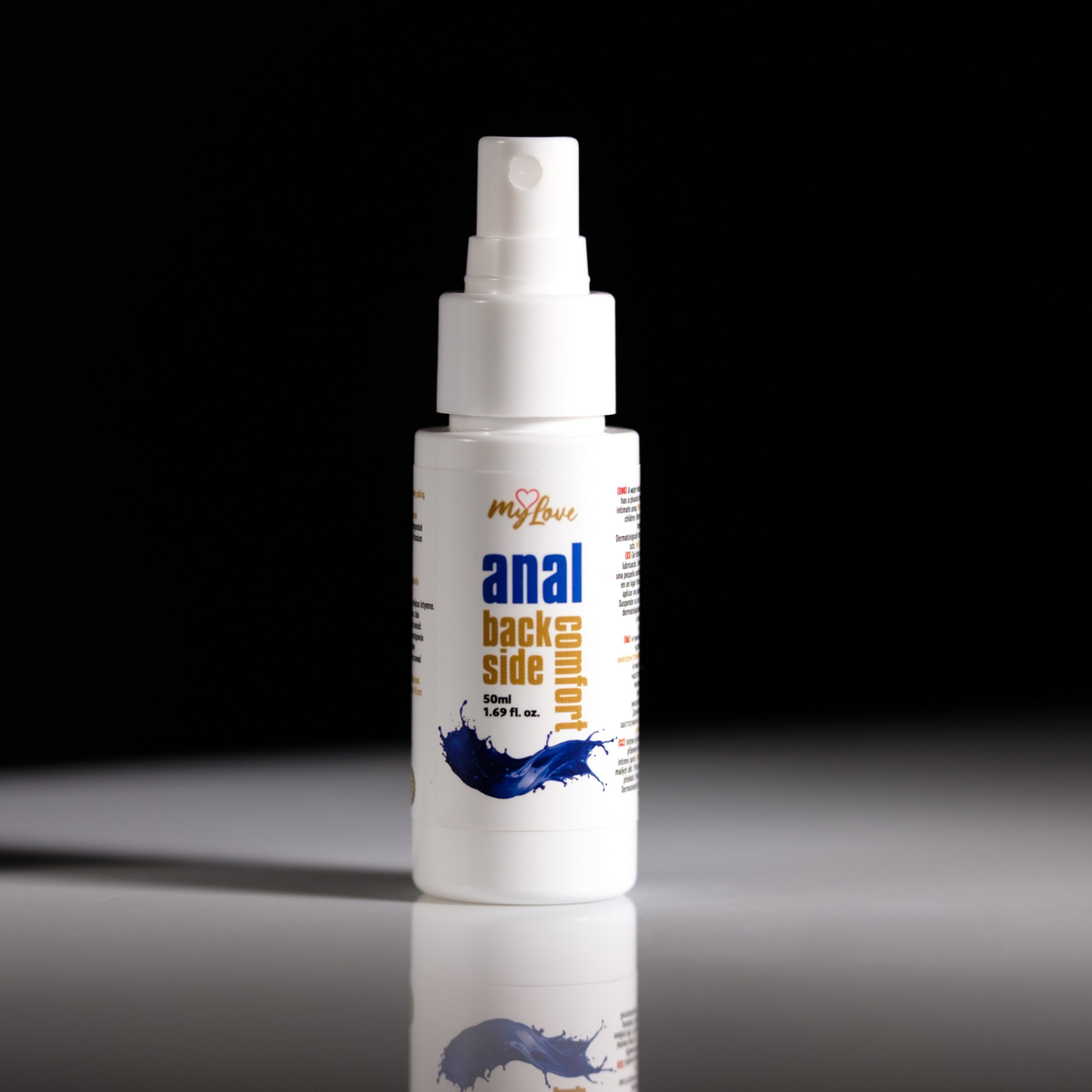 Front view of the 50 ml travel-size MyLove Anal Back Side Comfort spray bottle standing on a glossy surface against a plain black background.