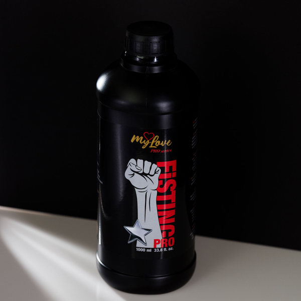 Front view of the MyLove Fisting Pro Gel 1000 ml bottle standing centered on a white surface against a solid black background.