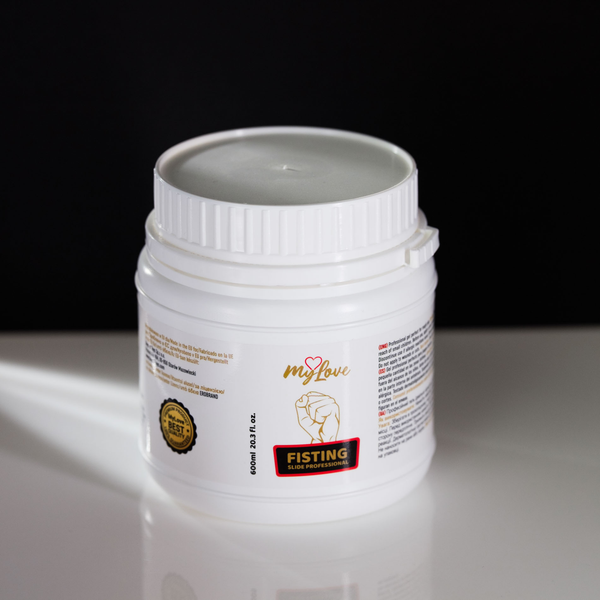 High-angle view of the 600 ml MyLove Fisting Slide Professional gel tub standing on a white reflective surface against a solid black backdrop.