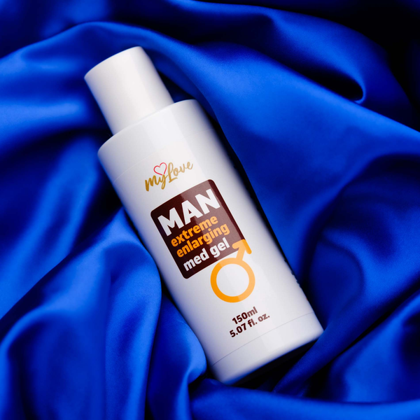 The 150 ml bottle of MyLove Man Extreme Enlarging Med Gel rests diagonally on draped, rich royal blue satin fabric.