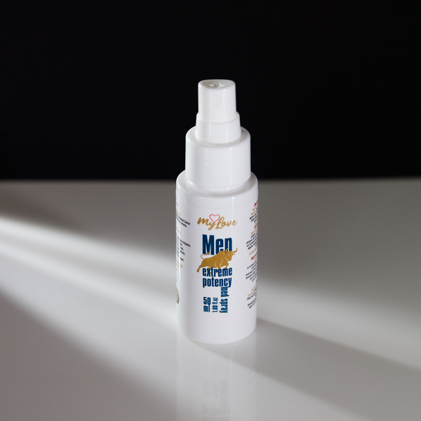 White spray bottle with text on a reflective surface and dark background