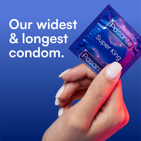 Hand holding a blue Pasante Super King condom wrapper against a blue gradient background with large white text reading “Our widest & longest condom.