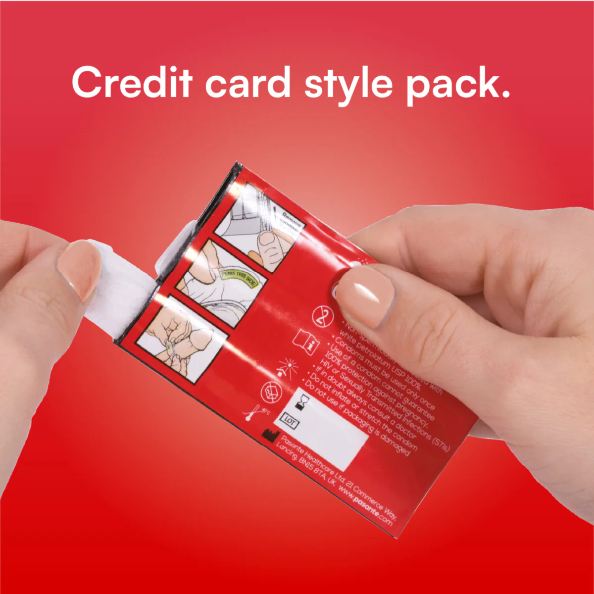 A close-up shot of a person's hands opening a red, credit card-style condom pack. The top of the image features the white text "Credit card style pack" against a red background. The back of the individual foil shows illustrated instructions and safety warnings.