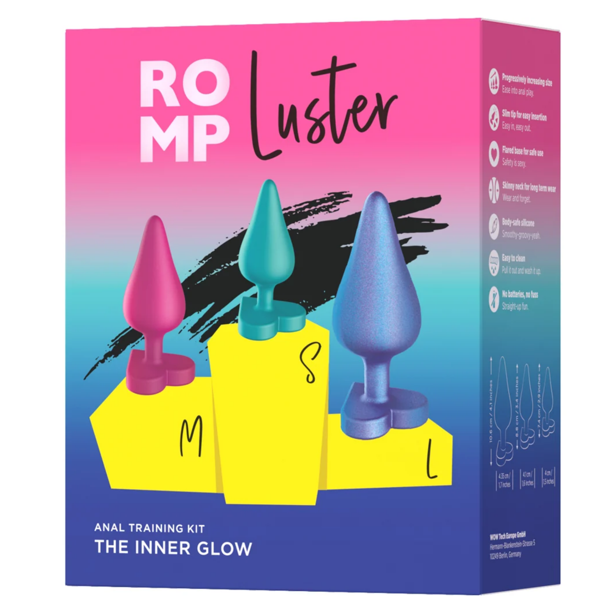 Front retail box packaging shot for the ROMP Luster Anal Training Kit "The Inner Glow", illustrating the three sizes (S, M, L) on a yellow podium with key feature callouts along the side. Hauptbild
