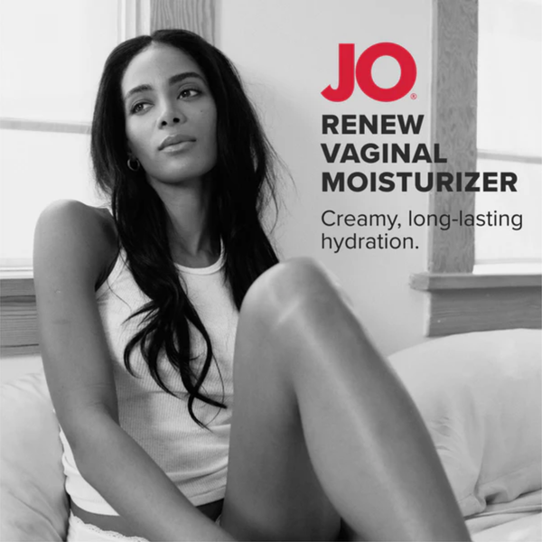 A black-and-white photograph of a woman sitting thoughtfully on a bed, with the red "JO" logo and the text "RENEW VAGINAL MOISTURIZER: Creamy, long-lasting hydration" displayed on the right.
