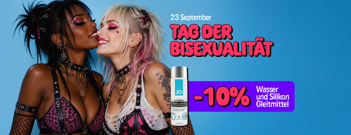 Promotional poster for Bisexuality Day, 23rd September. Two women in colorful alternative-style outfits and makeup pose closely together against a blue background, smiling with their faces touching. A purple promotional banner advertises “-10% Water & Silicone Lubes”, alongside an image of a personal lubricant bottle.