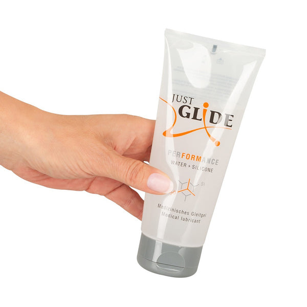 Woman hand holding Just Glide Performance 200ml Tube Lubricant